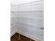 Walk-in pantry with wire shelving, white walls, white trim, and hardwood flooring at 2249 Knoxhill Se Vw, Smyrna, GA 30082