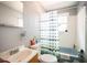 Simple bathroom with a tub/shower, sink, and toilet, offering a basic and functional space at 311 Henry Aaron Ave, Atlanta, GA 30310