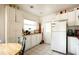 Kitchen with white cabinets, adjacent eating area and ample counter space, with white tile floor at 311 Henry Aaron Ave, Atlanta, GA 30310