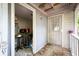 Enclosed back porch or mudroom with convenient access to utilities and storage with metal door at 311 Henry Aaron Ave, Atlanta, GA 30310