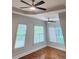 Bedroom with hardwood floors, tray ceiling, and plenty of natural light at 3858 Glenlake Dr, Douglasville, GA 30134