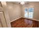 Bedroom featuring hardwood floors and a window at 3858 Glenlake Dr, Douglasville, GA 30134