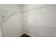 Walk-in closet with wood floor and shelving for optimal storage at 3858 Glenlake Dr, Douglasville, GA 30134