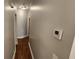 Hallway featuring hardwood floors and neutral paint at 3858 Glenlake Dr, Douglasville, GA 30134