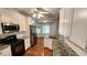 Bright kitchen with stainless steel appliances, granite countertops and hardwood floors at 3858 Glenlake Dr, Douglasville, GA 30134