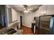 Modern kitchen featuring granite countertops, stainless steel appliances, and white cabinets at 3858 Glenlake Dr, Douglasville, GA 30134