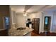 Well-lit kitchen with granite countertops, stainless steel appliances, and white cabinetry at 3858 Glenlake Dr, Douglasville, GA 30134