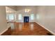 Spacious living room featuring hardwood floors and a fireplace at 3858 Glenlake Dr, Douglasville, GA 30134