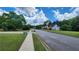 Neighborhood street view features well-maintained lawns and sidewalks on a sunny day at 3858 Glenlake Dr, Douglasville, GA 30134