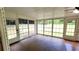 Spacious sunroom with walls of windows, tile flooring and access to backyard at 3858 Glenlake Dr, Douglasville, GA 30134