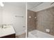 Bathroom with a soaking tub, shower, vanity, and neutral-colored tiling at 221 Semel Nw Dr # 273, Atlanta, GA 30309