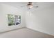 Bright bedroom with a window overlooking the yard and a ceiling fan at 221 Semel Nw Dr # 273, Atlanta, GA 30309