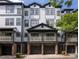 Charming townhouse with a private balcony, stone accents, and a two-car garage at 221 Semel Nw Dr # 273, Atlanta, GA 30309
