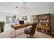 A home office with rustic wood desk, book shelves, and a leather chair at 221 Semel Nw Dr # 273, Atlanta, GA 30309