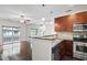 Modern kitchen open to living room, featuring stainless appliances and granite countertops at 221 Semel Nw Dr # 273, Atlanta, GA 30309