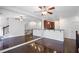 Open-concept living area with hardwood floors and kitchen in background at 221 Semel Nw Dr # 273, Atlanta, GA 30309
