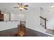 Open-concept living area with hardwood floors, leading into the kitchen and staircase at 221 Semel Nw Dr # 273, Atlanta, GA 30309