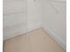 A walk-in closet features wire shelving and neutral carpet at 221 Semel Nw Dr # 273, Atlanta, GA 30309