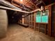 Unfinished basement with concrete floor, shelving and a window for natural light at 2636 Whiteleigh Ne Ct, Atlanta, GA 30345