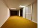 Unfinished basement with large storage closet and carpeted floor at 2636 Whiteleigh Ne Ct, Atlanta, GA 30345