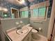 Well-lit bathroom with a sink, toilet, and vanity at 2636 Whiteleigh Ne Ct, Atlanta, GA 30345