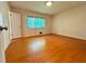 Bright bedroom with hardwood floors and a large window at 2636 Whiteleigh Ne Ct, Atlanta, GA 30345