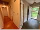 The foyer features classic wallpaper, slate tile flooring, and an adjacent hallway at 2636 Whiteleigh Ne Ct, Atlanta, GA 30345