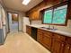 Kitchen featuring wood cabinets, white appliances, and contrasting countertops at 2636 Whiteleigh Ne Ct, Atlanta, GA 30345