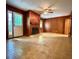 This living room features wood walls, patterned tile flooring, fireplace and backyard access at 2636 Whiteleigh Ne Ct, Atlanta, GA 30345