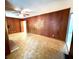 Bright and airy living room featuring wood paneling and ceiling fan at 2636 Whiteleigh Ne Ct, Atlanta, GA 30345
