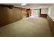 Spacious living room featuring carpeted floors and a bar area at 2636 Whiteleigh Ne Ct, Atlanta, GA 30345