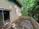 Outdoor patio with brick detailing and sliding glass door at 2636 Whiteleigh Ne Ct, Atlanta, GA 30345