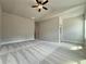 Expansive bedroom with vaulted ceiling and fan, showing entrance and closet for an ample, adaptable space at 5710 Urban Village Way # 6, Tucker, GA 30084