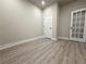Bright office with light wood flooring, white trim, and two doors for easy access and a clean, modern aesthetic at 5710 Urban Village Way # 6, Tucker, GA 30084