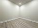 Versatile room featuring neutral paint, modern flooring, and ample natural light at 5710 Urban Village Way # 6, Tucker, GA 30084