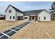 Backyard view of home with pergola, patio, and stone walkway at 590 Hood Ave, Fayetteville, GA 30214