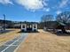 Spacious backyard with modern shed, playground, and basketball court for outdoor fun at 590 Hood Ave, Fayetteville, GA 30214