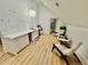 Well-lit bar area with marble counters, sink, and two chairs at 590 Hood Ave, Fayetteville, GA 30214