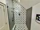 Stylish bathroom featuring a glass enclosed shower with patterned tile at 590 Hood Ave, Fayetteville, GA 30214