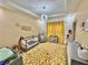 Charming Bedroom featuring a crib, accent rug, stylish lighting, and decorative wall features at 590 Hood Ave, Fayetteville, GA 30214
