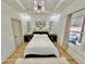 Cozy bedroom with tray ceiling, recessed lighting, natural light, and minimalistic decor at 590 Hood Ave, Fayetteville, GA 30214