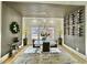 Modern dining room with wood accent wall, chandelier and seating for four at 590 Hood Ave, Fayetteville, GA 30214