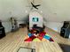 A spacious game room featuring a ceiling fan, arcade games, and a foosball table at 590 Hood Ave, Fayetteville, GA 30214