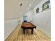 A game room featuring a pool table under the sloped roof at 590 Hood Ave, Fayetteville, GA 30214