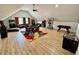 Bright and open game room with arcade games, a foosball table, and a seating area at 590 Hood Ave, Fayetteville, GA 30214