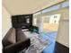 Sleek interior featuring a modern fireplace, comfortable seating, and seamless access to the outdoors at 590 Hood Ave, Fayetteville, GA 30214