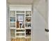 Walk-in pantry features custom shelving, a window, and plenty of room for storage at 590 Hood Ave, Fayetteville, GA 30214