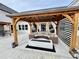 Covered patio featuring a comfortable lounge area with a fire pit at 590 Hood Ave, Fayetteville, GA 30214