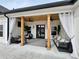 Covered porch with comfortable seating and ceiling fans at 590 Hood Ave, Fayetteville, GA 30214