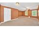 Bedroom features neutral carpet, ceiling fan, and two windows offering natural light at 214 Kingsley Way, Woodstock, GA 30188